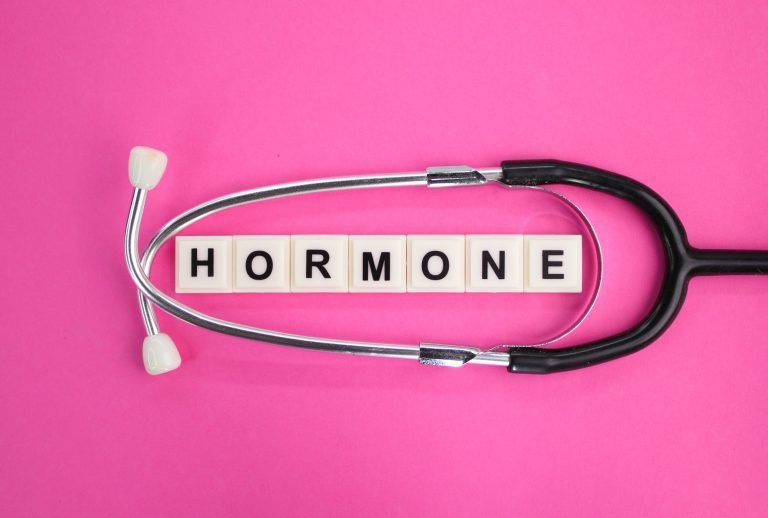 stethoscope and alphabet letters with the word hormone.