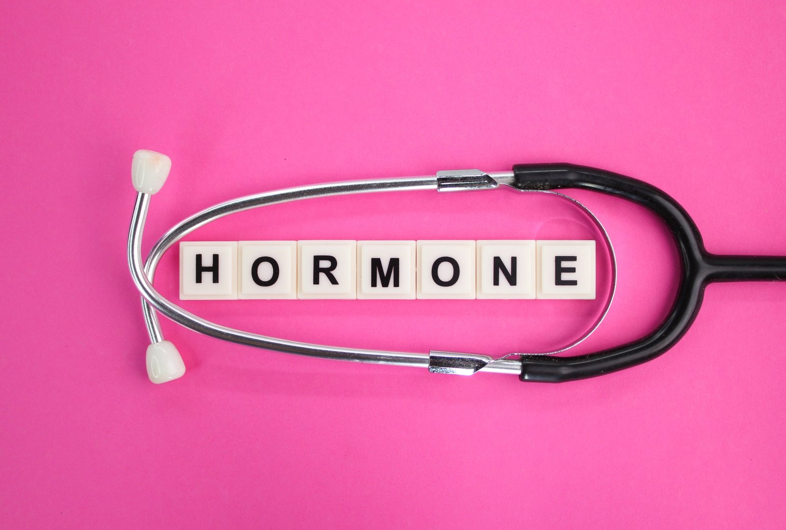 stethoscope and alphabet letters with the word hormone.